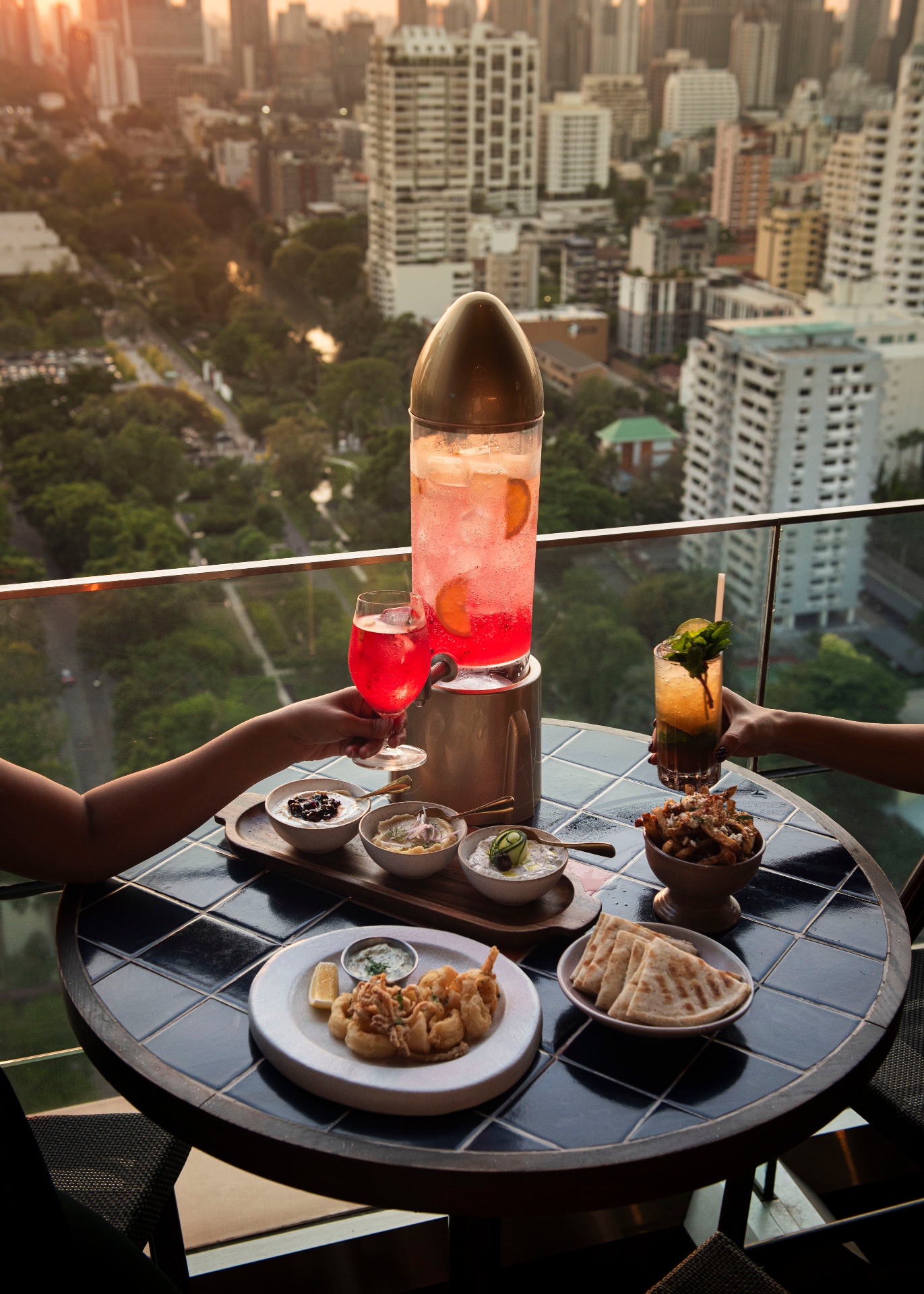 Rooftop sunset cocktails with a 3L cocktail tower at Aesops
